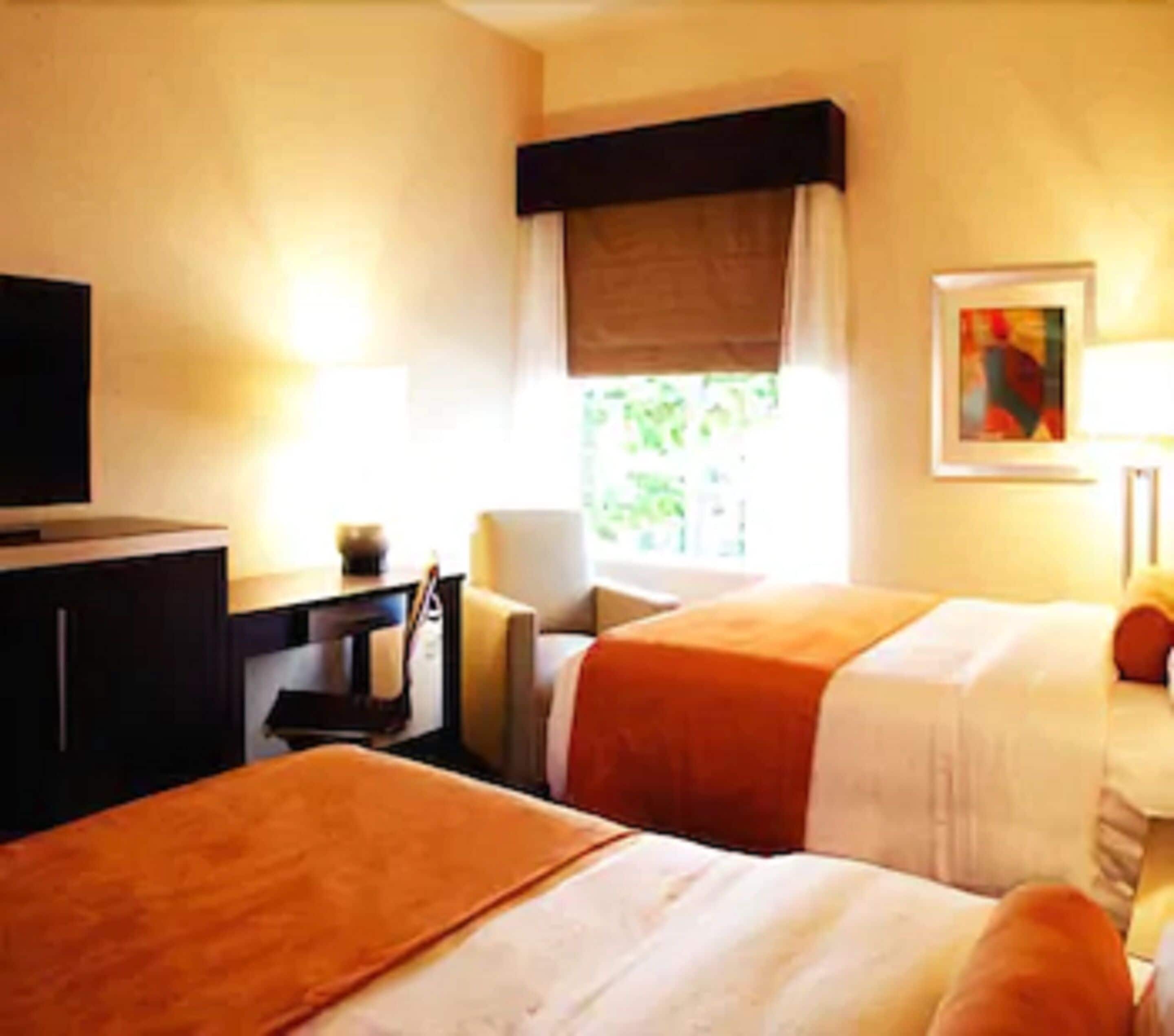 standard room, 2 queen beds | desk, iron/ironing board, free cots/infant beds, rollaway beds