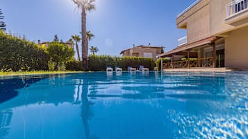 Outdoor pool, open 9:00 AM to 9:00 PM, pool umbrellas, sun loungers