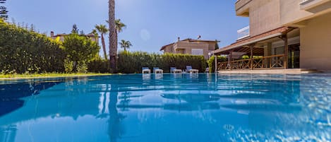 Outdoor pool, open 9:00 AM to 9:00 PM, pool umbrellas, sun loungers