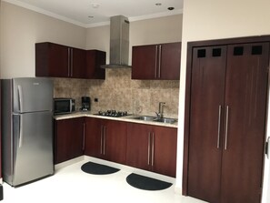 Grand Apartment, 2 Bedrooms | Private kitchen | Microwave, electric kettle