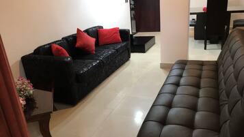 Family Apartment, 2 Bedrooms, 2 Bathrooms | Living area | 32-inch plasma TV with cable channels