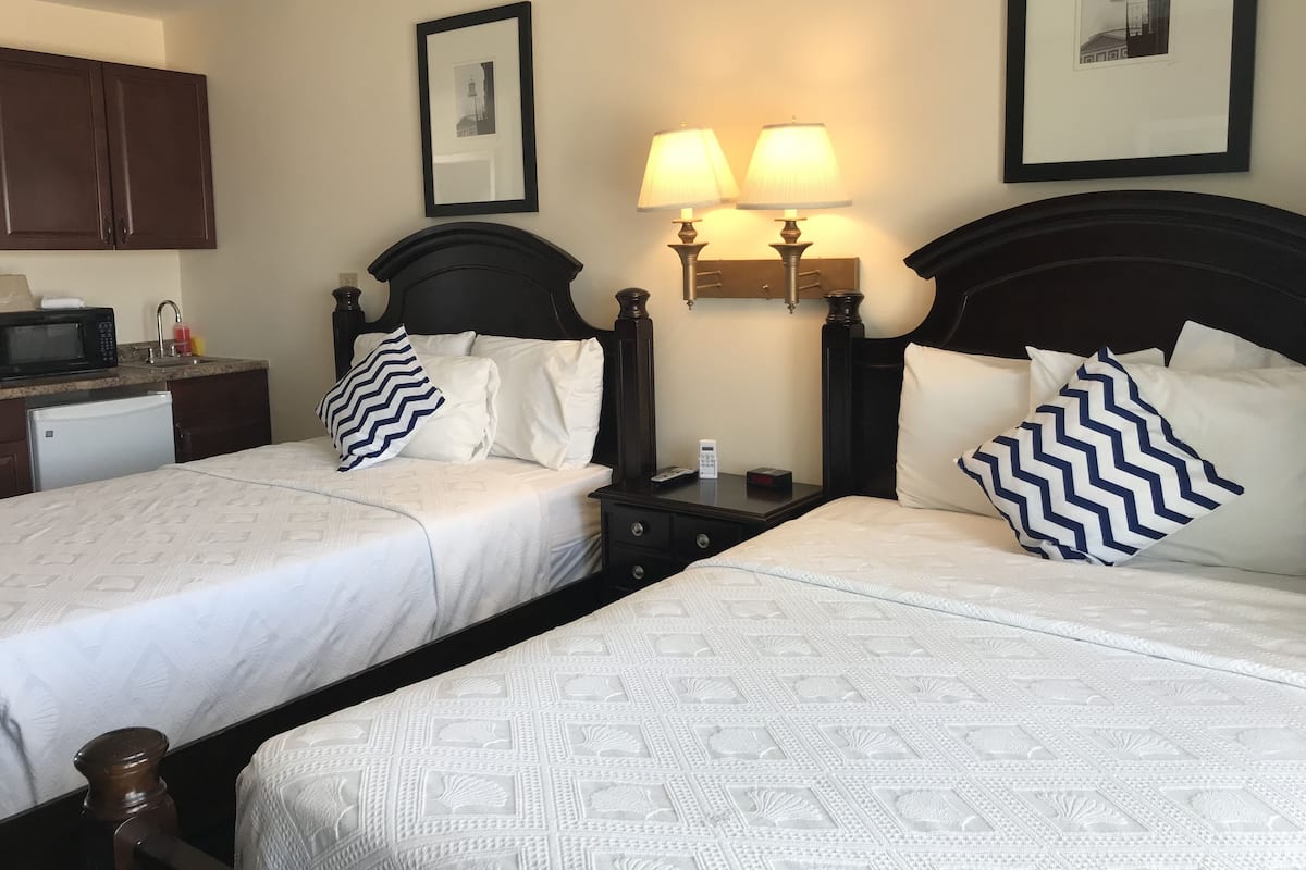 Desk, laptop workspace, blackout drapes, iron/ironing board