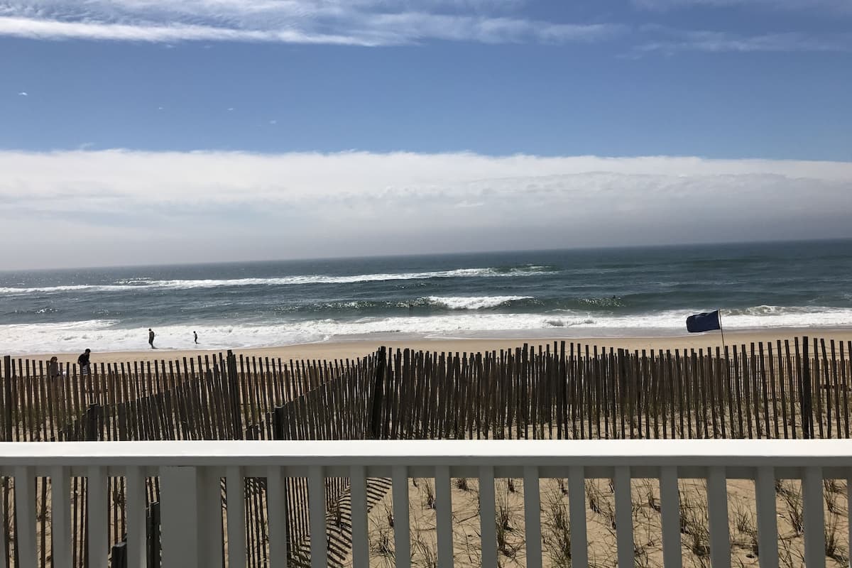 Desk, laptop workspace, blackout drapes, iron/ironing board