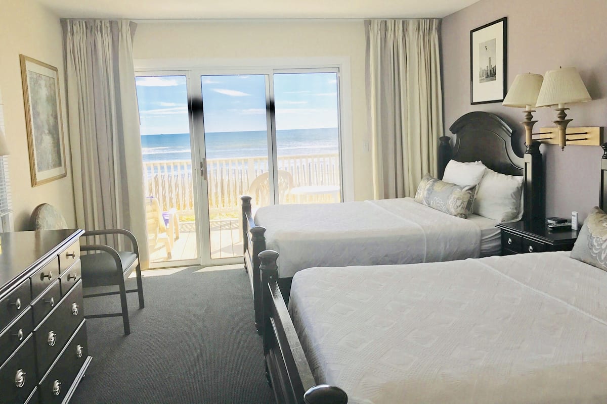 Desk, laptop workspace, blackout drapes, iron/ironing board