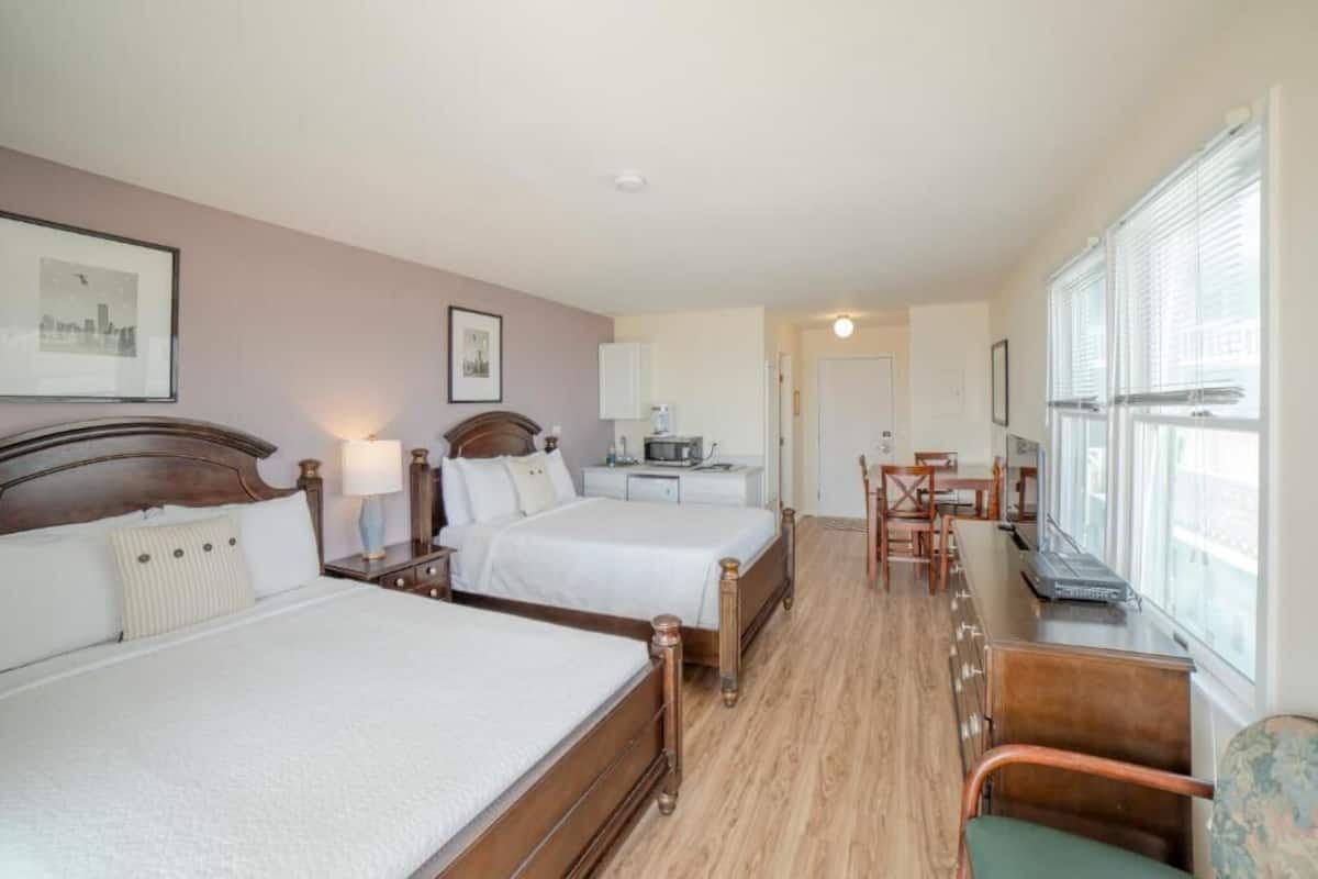 Desk, laptop workspace, blackout drapes, iron/ironing board