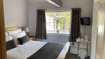 Premium bedding, blackout curtains, iron/ironing board, free WiFi