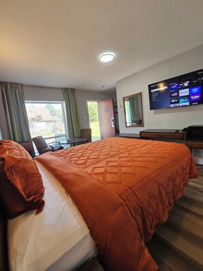 Premium bedding, desk, laptop workspace, blackout drapes