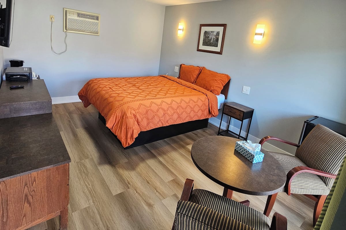 Premium bedding, desk, laptop workspace, blackout drapes