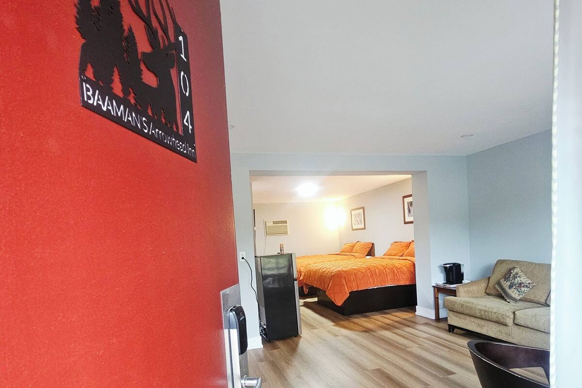 Premium bedding, desk, laptop workspace, blackout drapes
