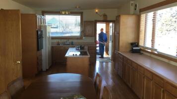 Cottage, 4 Bedrooms | Private kitchen | Fridge, microwave, coffee/tea maker