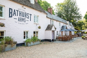 A white building with the sign "Bathurst Arms" indicating it is a pub, eating house, and rooms.