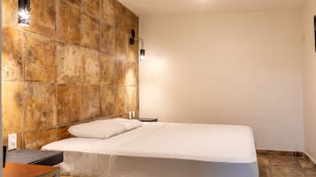 Desk, laptop workspace, bed sheets