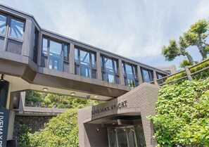 A modern building with a prominent entrance labeled "LIVE MAX RESORT". - LiVEMAX RESORT Jogasaki Kaigan (Ito)