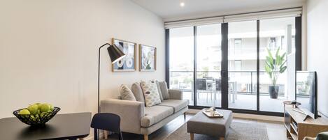 One Bedroom Terrace Apartment | Living area | 50-inch Smart TV with digital channels, TV, streaming services