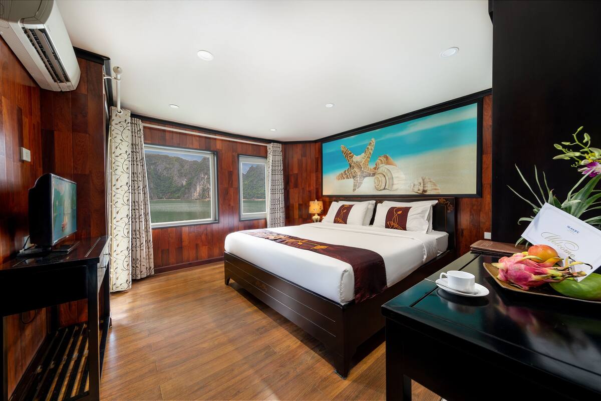 Ropa de cama de alta calidad, minibar, caja fuerte y escritorio