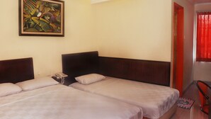 A hotel room with two beds, a painting on the wall, and a red curtain. - Plaza Hotel Harco Mangga Dua (Jakarta)