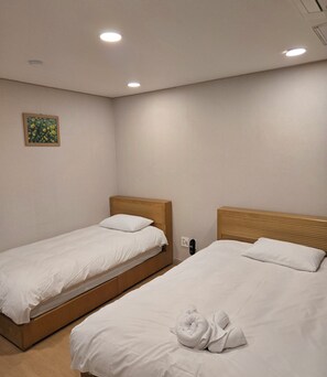 Room | Premium bedding, down comforters, blackout drapes, free WiFi