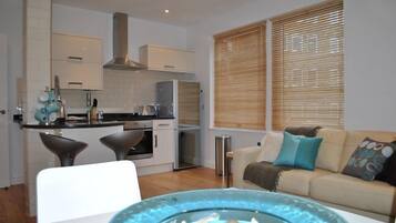 Apartment, 2 Bedrooms (The Courtyard 2) | Living area | Flat-screen TV, DVD player