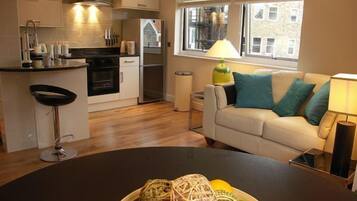 Apartment, 2 Bedrooms (The Courtyard 5) | Living area | Flat-screen TV, DVD player