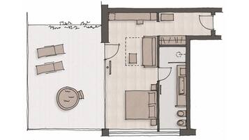 A floor plan of a hotel room with a bed, a desk, a chair, a small table, and a circular seating area.