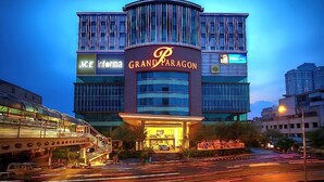A hotel with a prominent 'Grand Paragon' sign, multiple floors, and a modern glass facade. - Grand Paragon (Jakarta)
