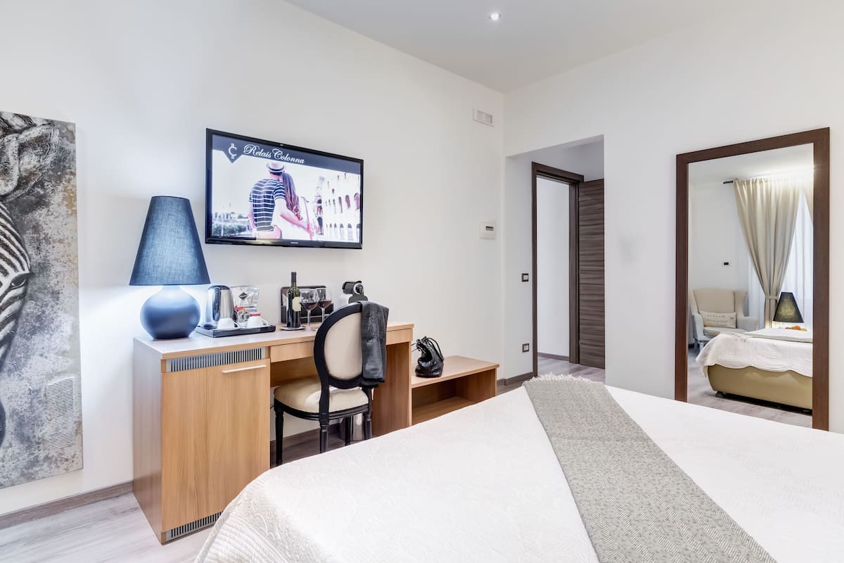 Suite | Ropa de cama de alta calidad, edredón y artículos del minibar gratis