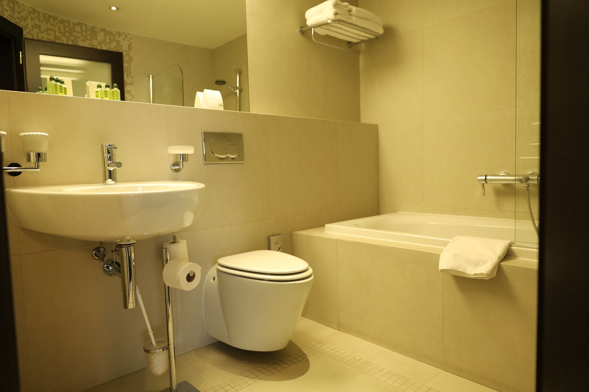 bathtub, designer toiletries, hair dryer, bathrobes