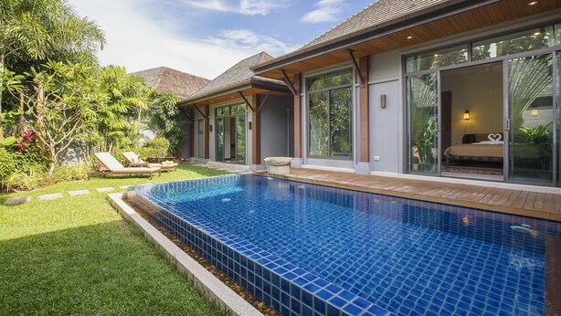 A modern house with a swimming pool, large windows, and a well-maintained garden. - Saiyuan Estate by TropicLook (Rawai)