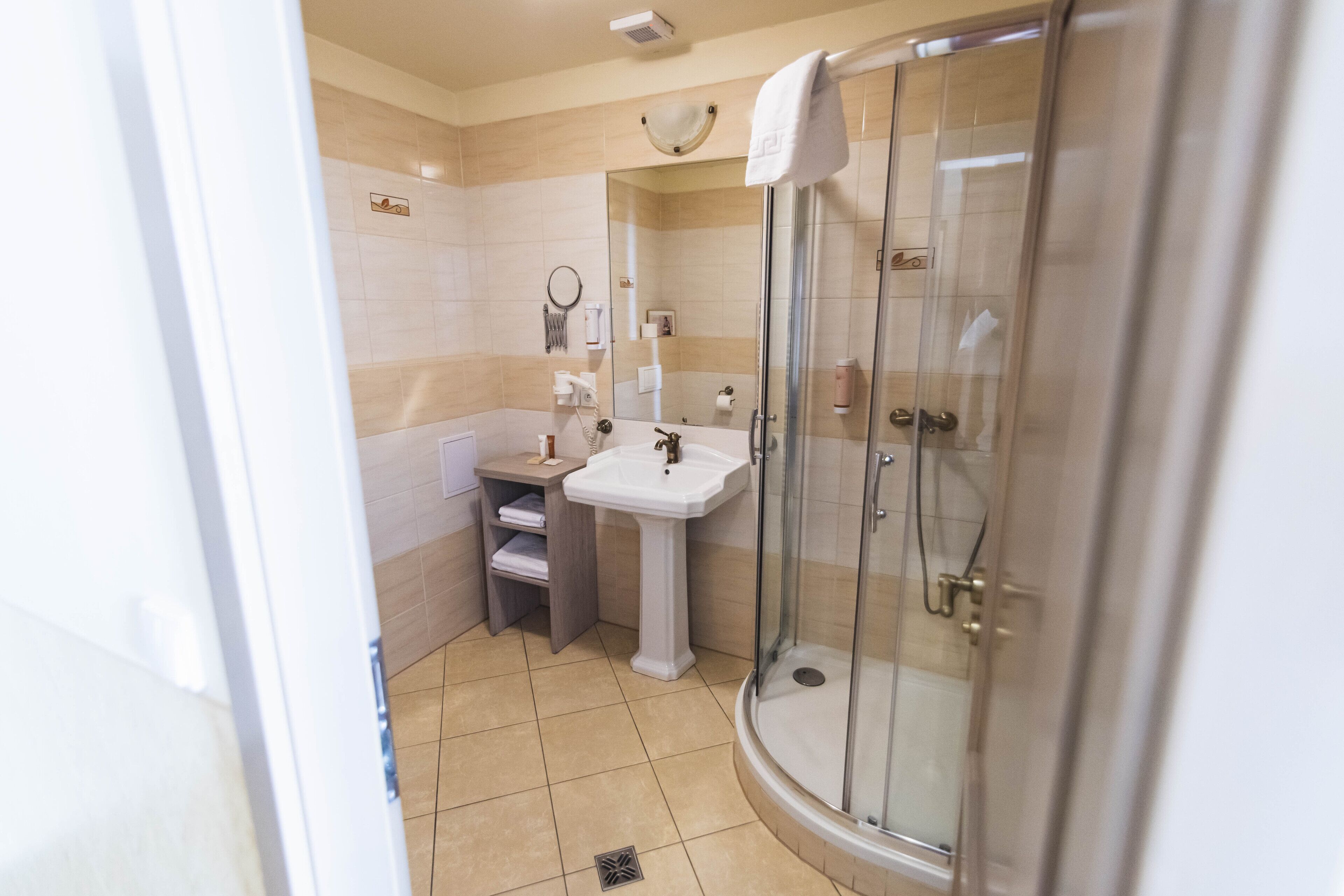 shower, hair dryer, bathrobes, slippers