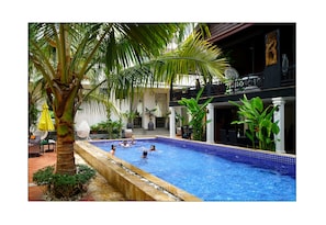 Outdoor pool, pool umbrellas, sun loungers