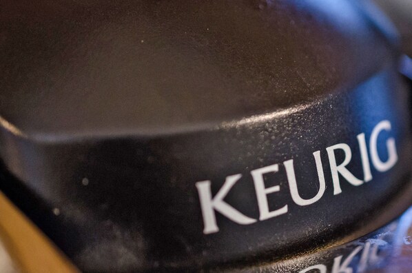 A close-up of a black object with the word "KEURIG" on it.