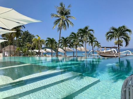 2 outdoor pools, open 6:00 AM to 7:00 PM, free cabanas, pool umbrellas