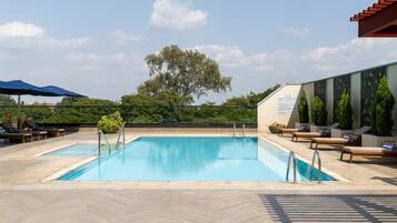 Outdoor pool, pool umbrellas, sun loungers