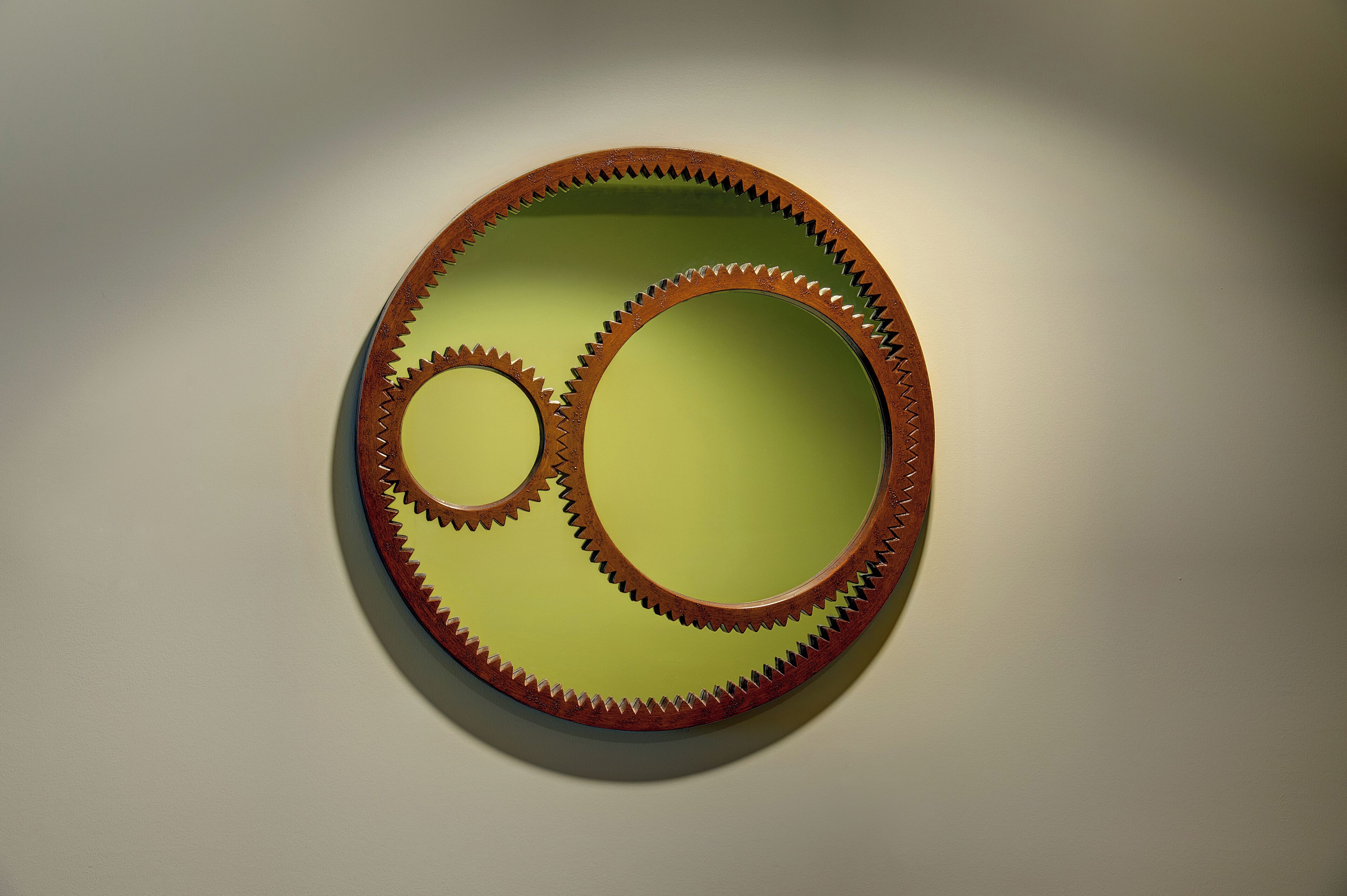 A circular wall decoration with interlocking gears.