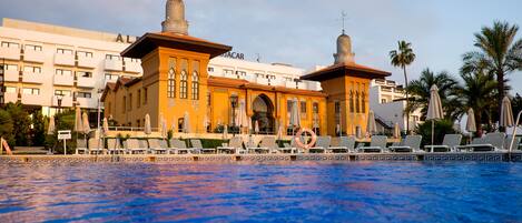 Outdoor pool, pool umbrellas, sun loungers