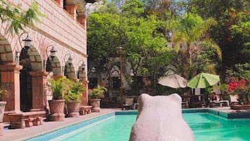 Outdoor pool, open 9 AM to 11:00 PM, pool umbrellas, pool loungers