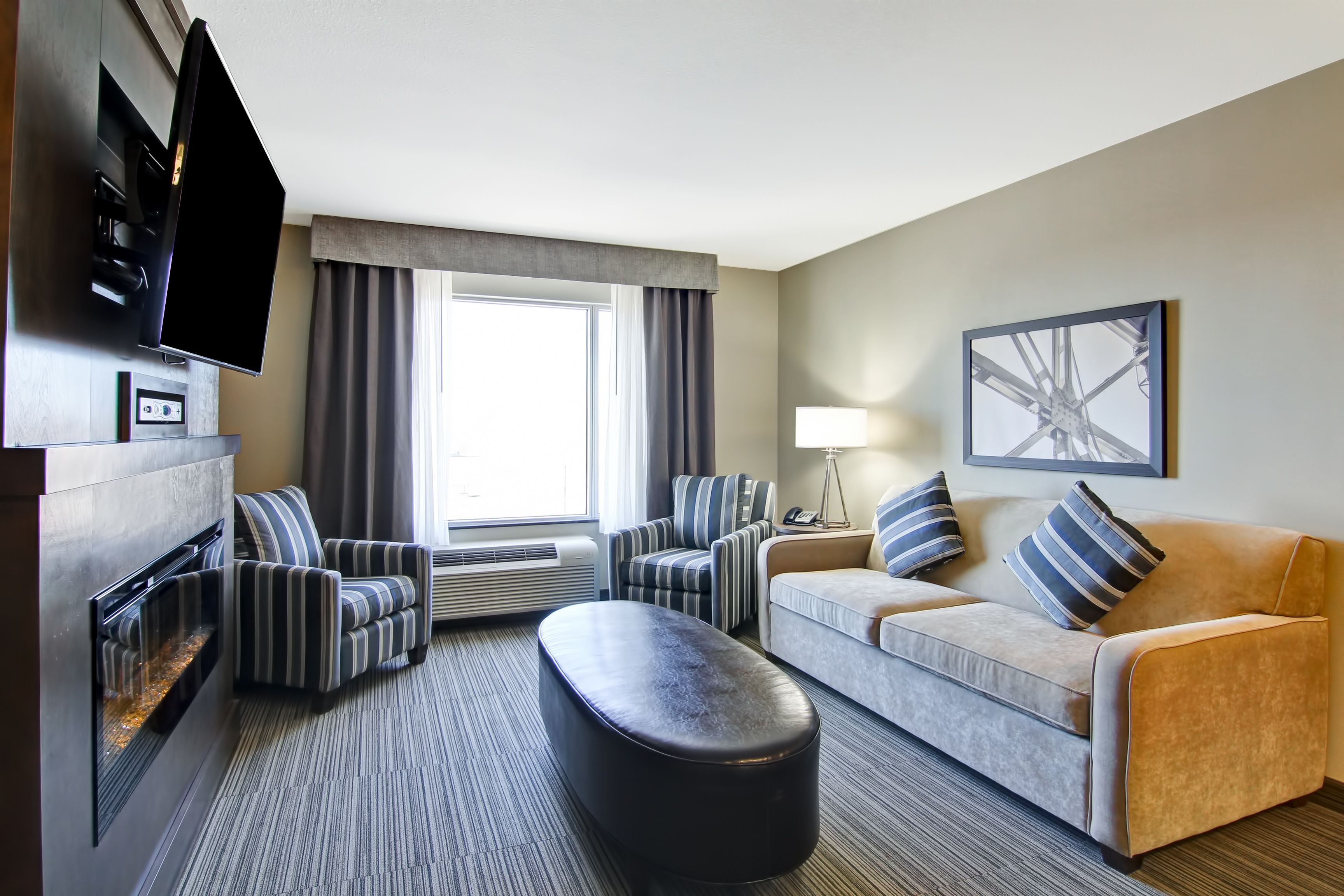 suite, 2 queen beds, kitchenette | living area | flat-screen tv