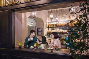 A restaurant with a bar area where people are dining.