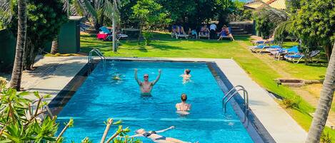 Outdoor pool, free cabanas, pool umbrellas