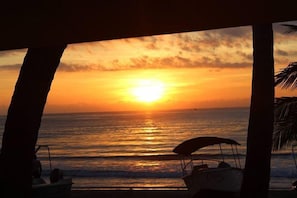On the beach, white sand, sun loungers, beach umbrellas