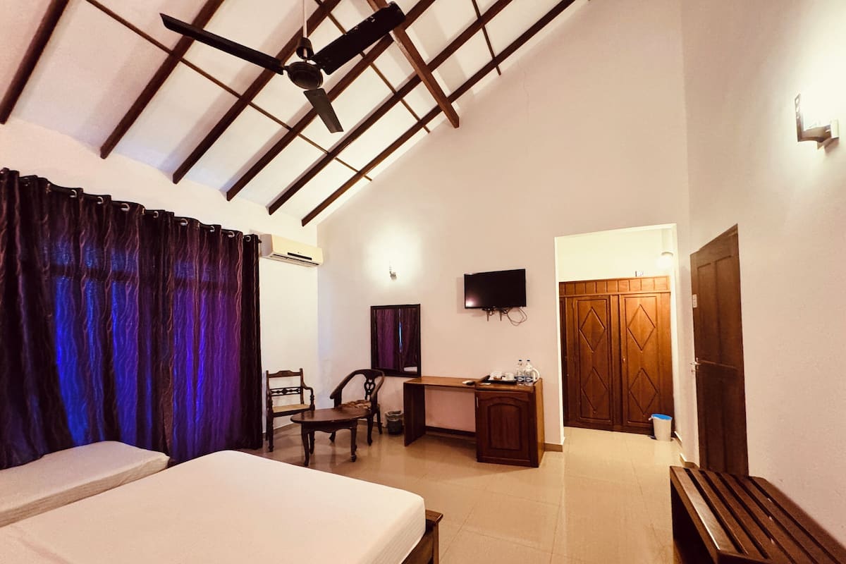 Habitació quàdruple Deluxe | Roba de llit d'alta qualitat i matalassos amb encoixinament addicional