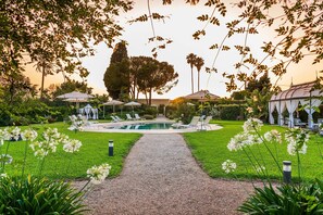 Seasonal outdoor pool, a lap pool, free pool cabanas, pool umbrellas