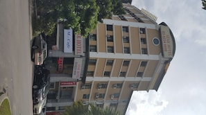 A multi-story hotel with balconies, a cafe, and a visible Star Hotel sign. - First and New Star Hotel (Kuala Lumpur)