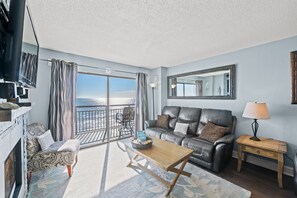Condo, 2 Bedrooms, Fireplace, Oceanfront (601 - Corner Unit) | Living area | TV, DVD player - Bluewater Resort by Elliott Beach Rentals (Myrtle Beach)