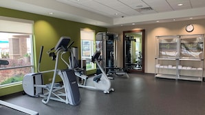 A gym with treadmills, elliptical machines, and weight machines. - Home2 Suites by Hilton Fort Smith AR (Fort Smith)