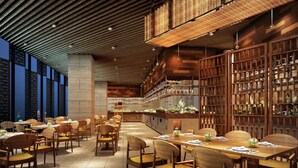 A modern restaurant interior with wooden furniture, a central bar area, and a view of the cityscape through large windows. - Hilton Suzhou (Suzhou)