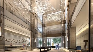 A spacious lobby with a high ceiling, modern design, and a central seating area. - Hilton Suzhou (Suzhou)
