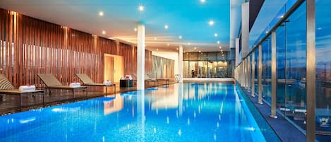 Indoor pool, open 6:00 AM to 9:00 PM, pool loungers