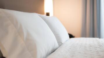 Desk, laptop workspace, blackout drapes, iron/ironing board