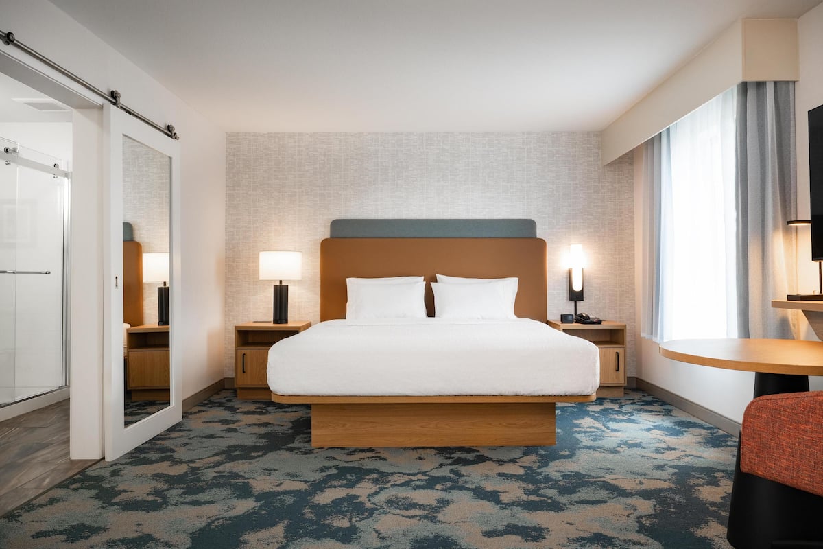 desk, laptop workspace, blackout curtains, iron/ironing board